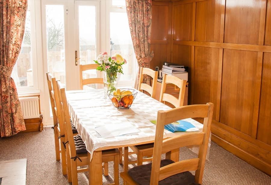 A bright, homely dining room in one of our supported living homes
